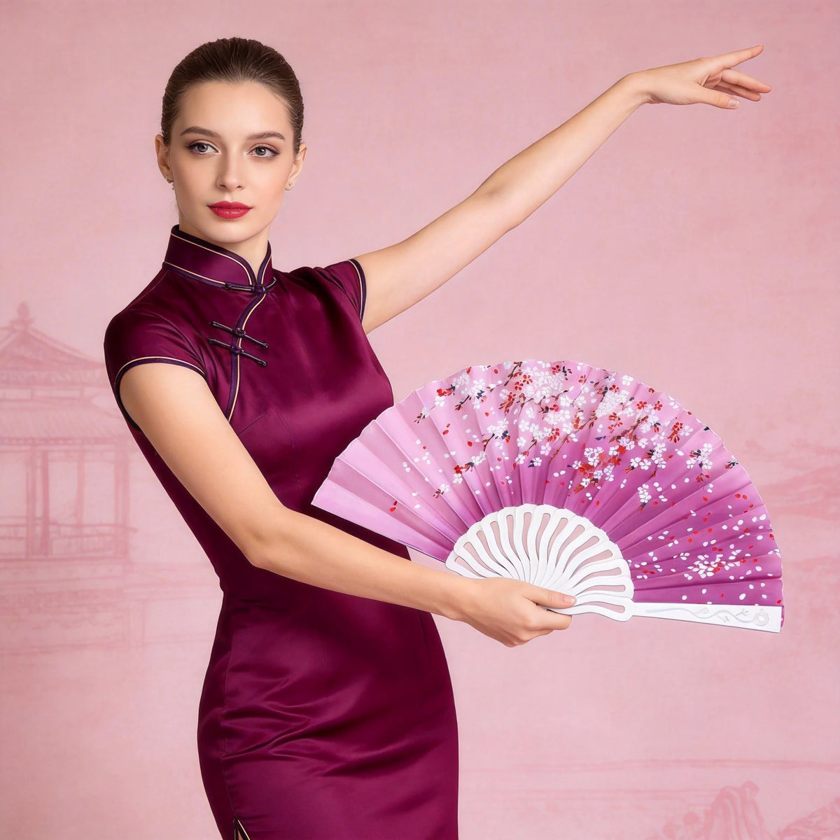 A woman in a purple dress holds an open pink and white folding fan.