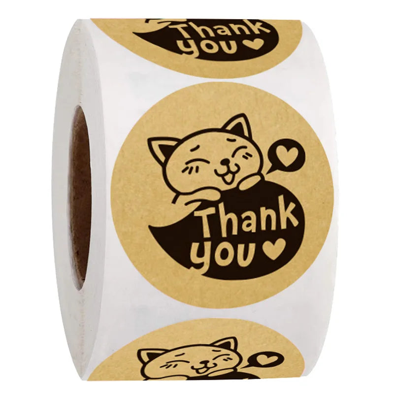 Roll of kraft paper thank you stickers with a cute cat design on the label