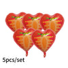 A set of six heart-shaped foil balloons in orange and red with green accents.
