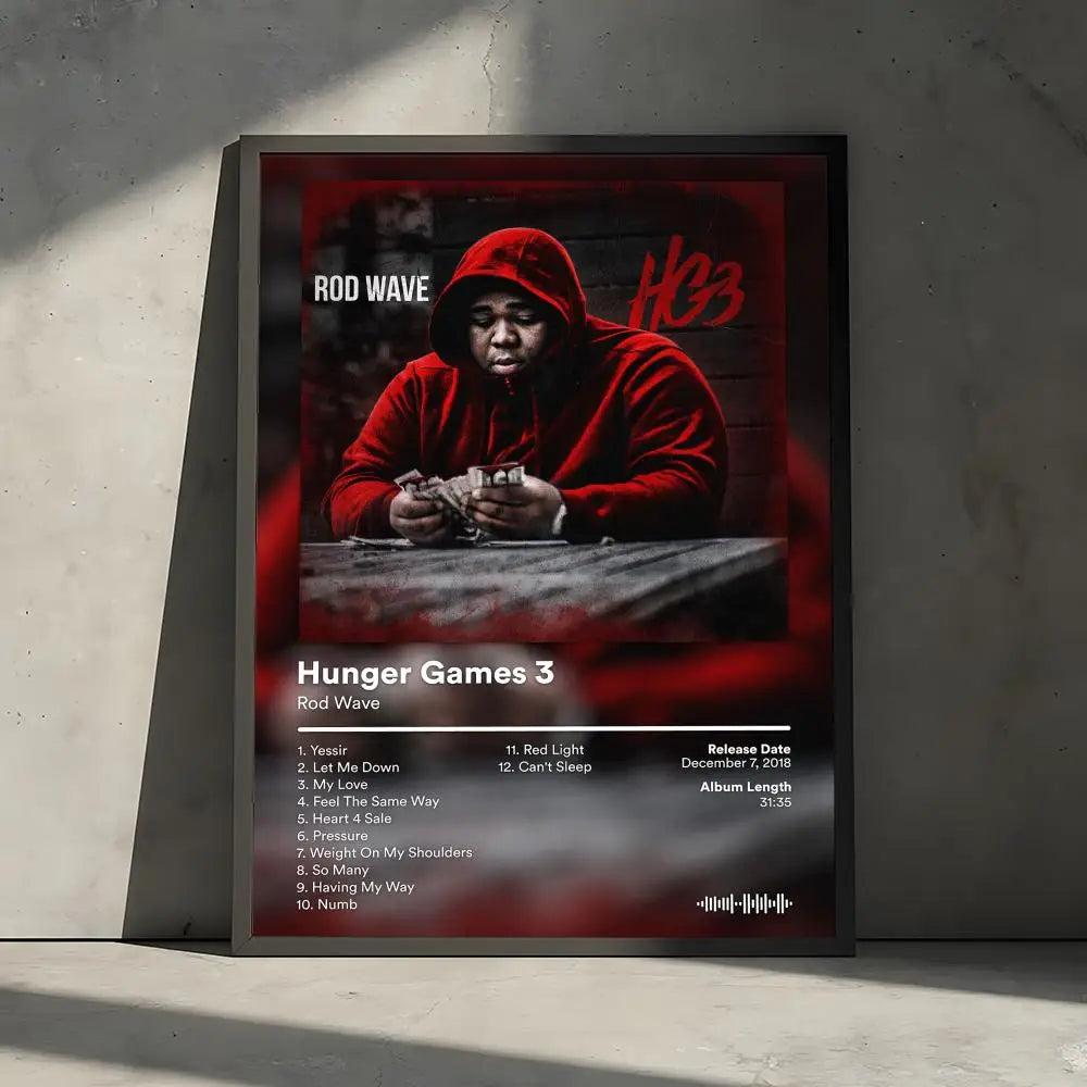 Album cover art for Hunger Games 3 by Rod Wave featuring a man in a red hoodie looking intensely at the camera.