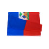 A folded Haitian flag display showing the national flag with a green border and a depiction of a palm tree.