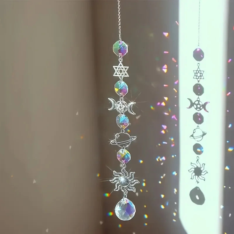 A silver crystal moon and sun wind chime decor set featuring various celestial shapes like stars, moons, and planets.