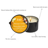 A massage candle in a black tin pot with a lit wick, showing natural soybean wax infused with essential oil.