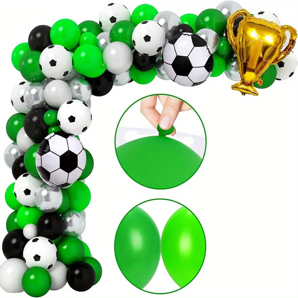 A balloon arch kit featuring various soccer balls, balloons, and a gold trophy.
