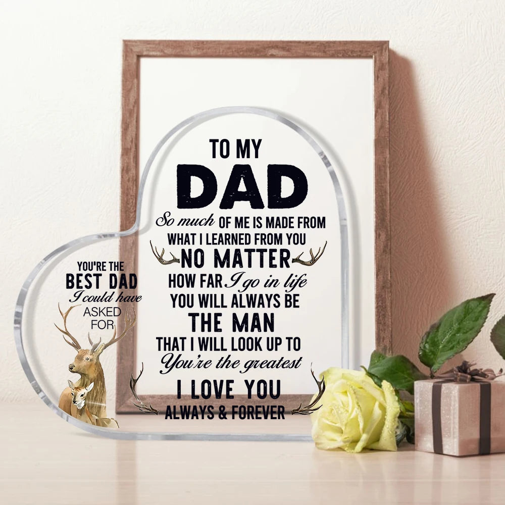 A framed piece of art with a heart shape and text dedicated to a dad, featuring a silhouette of a deer.