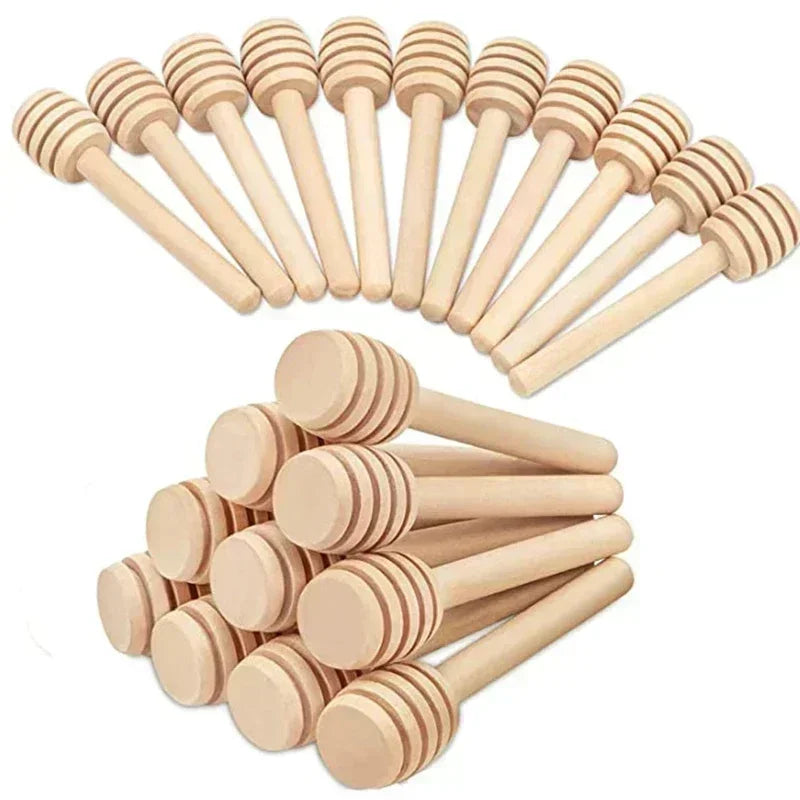 A set of ten natural wood honey dipper sticks arranged in a fan shape.