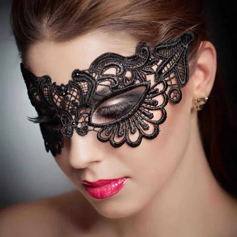 A close-up of a woman wearing a black lace floral eye mask for masquerade or cosplay.