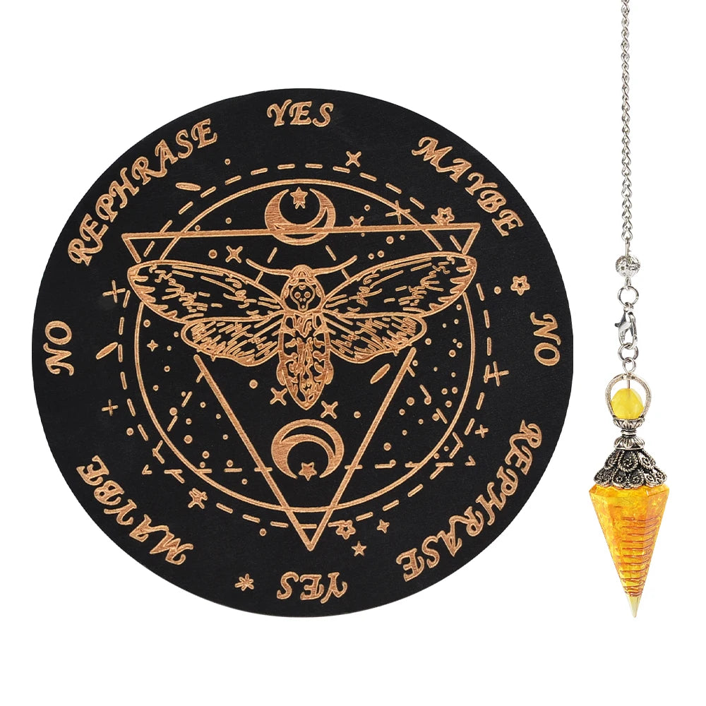 A black wooden pendulum board featuring a geometric design and an inlaid rose quartz crystal pendant on a silver chain.