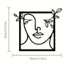 Black line art silhouette of a woman's face with leafy vines surrounding it.