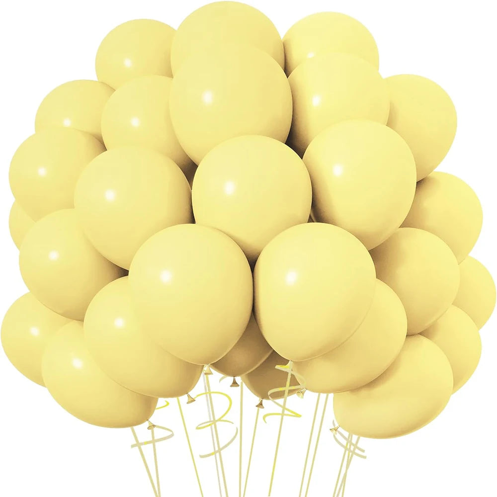 A bunch of pale yellow latex balloons tied together for a party or event decoration.