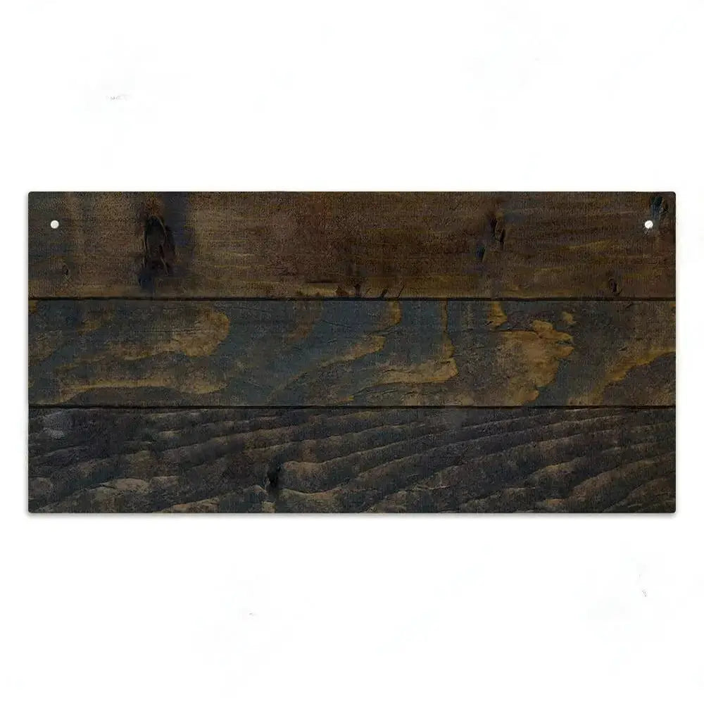 A rectangular wooden sign featuring horizontal planks of dark brown and black wood grain.