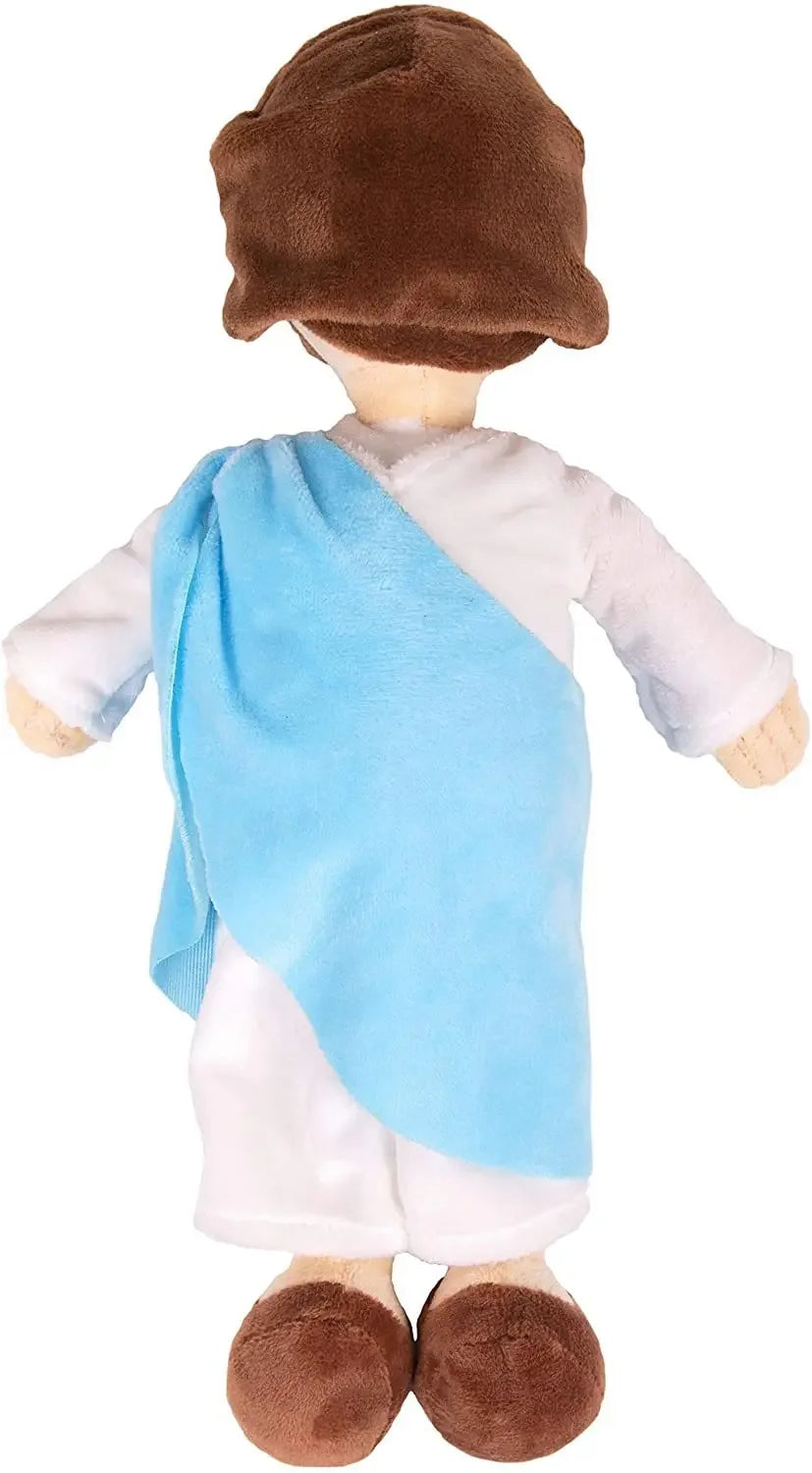 A plush doll depicting Jesus and the Virgin Mary, dressed in white robes and a blue shawl.