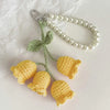 Handmade pearl chain orchid key ring with a light green fabric flower attached