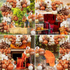 A display of orange, gold, and white latex balloons used for wedding or party decor.