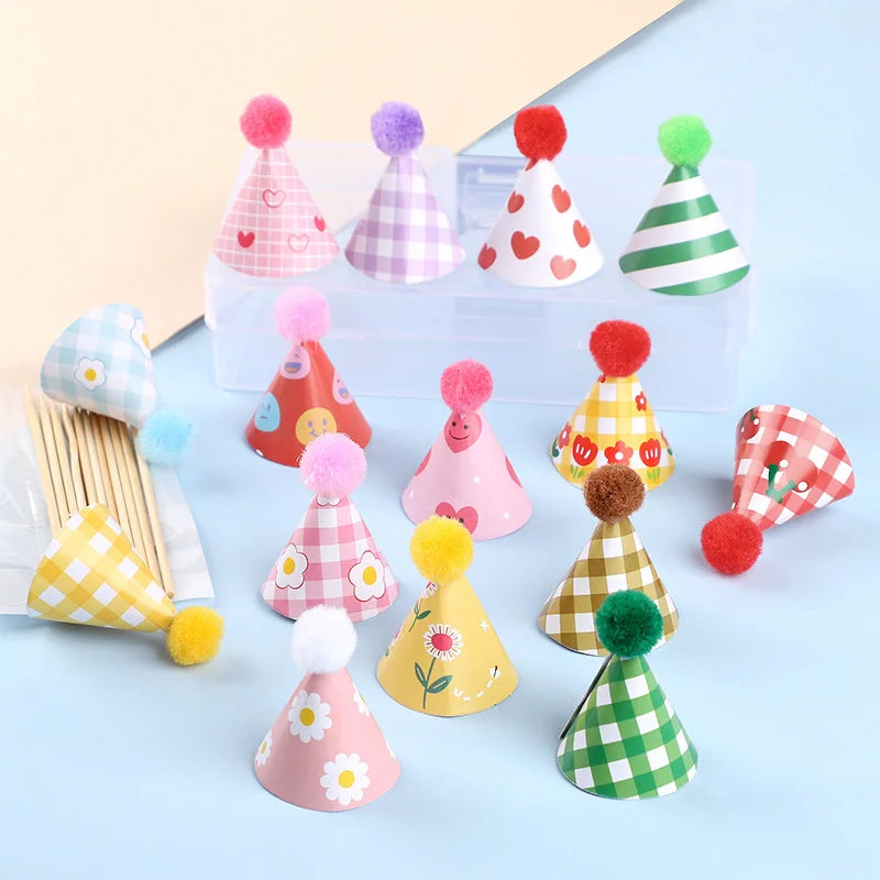 A set of mini birthday cake toppers in various colors and patterns including pink, green, and yellow.
