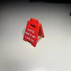 A red 3D printed letter sign ornament shaped like a house, with the text A LITTLE SIGN TO SAY I LOVE YOU engraved on it.