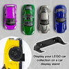 A display stand featuring four die-cast cars in purple, green, silver, and blue colors.