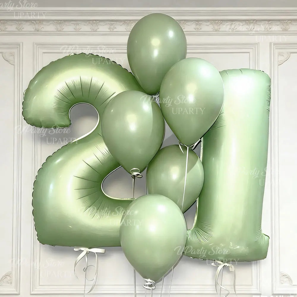 A cluster of large, light green foil number balloons forming the shape of the number 2.