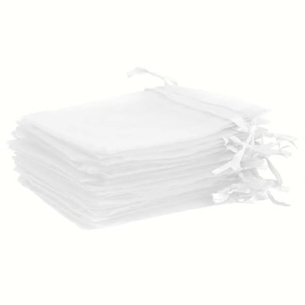 Stack of elegant white and gold drawstring organza bags for gifts, weddings, and parties