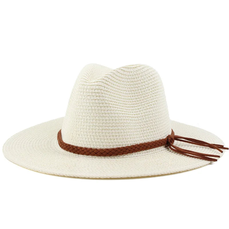 A wide brim straw sun hat in off-white with a brown leather cord detail.