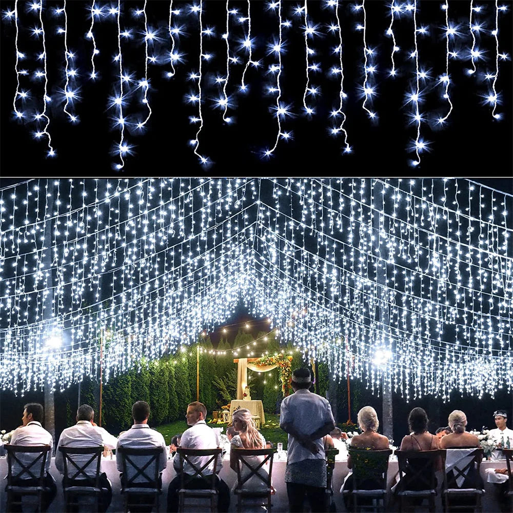 String lights hanging in a curtain formation creating a sparkling backdrop for an outdoor event or Christmas decoration