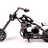 A handcrafted black metal motorcycle model, a vintage diecast display piece.