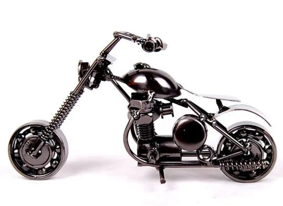A handcrafted black metal motorcycle model, a vintage diecast display piece.