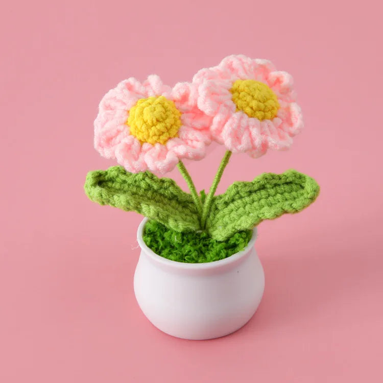 Hand woven crochet pink and yellow flowers in a white pot