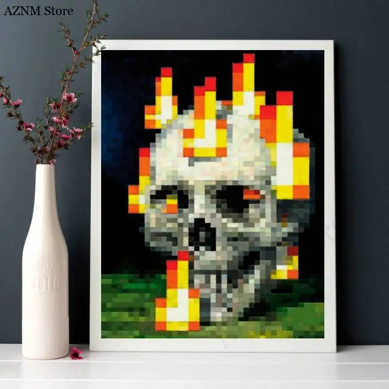 An art print depicting a pixelated skull engulfed in bright orange and yellow flames against a dark background.