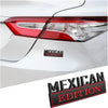 A close-up of a silver car's taillight with a black and red Mexican Edition emblem decal applied to the body.