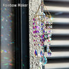 A hanging crystal rainbow maker decor featuring colorful glass prisms and dangling elements.