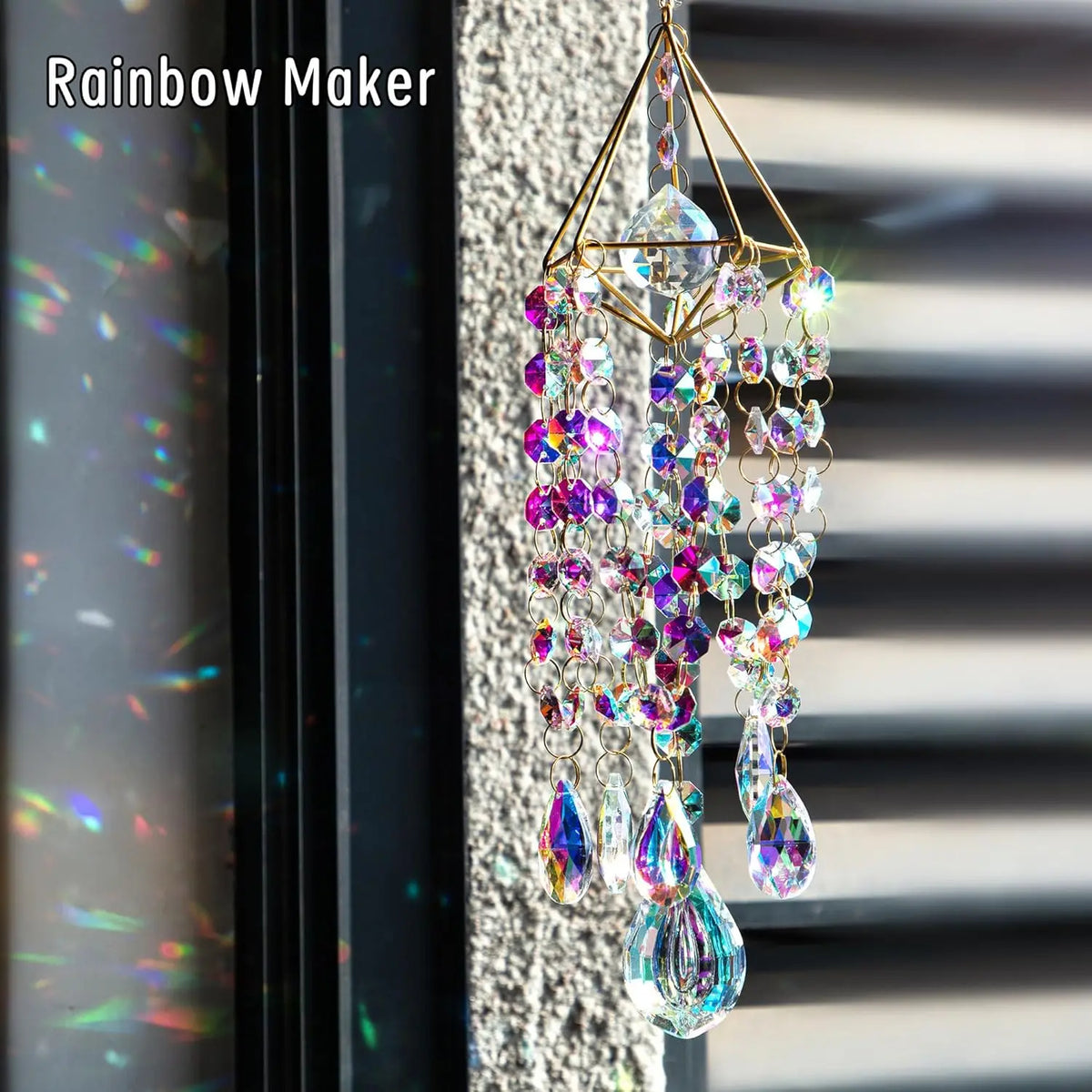 A hanging crystal rainbow maker decor featuring colorful glass prisms and dangling elements.