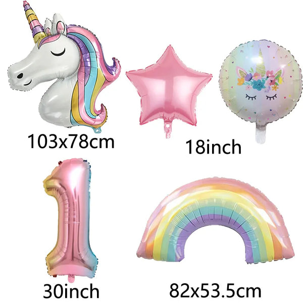 A set of foil balloons including a unicorn, a star, a number one, and a rainbow arch for a party decoration