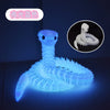 A glowing blue 3D printed snake art model with a white figure in a circular inset.