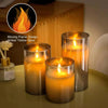 A set of amber yellow glow flameless LED pillar candles displayed on a surface.