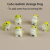 A set of six cute realistic strange frog figurines in white and yellow resin for desk or garden decor.