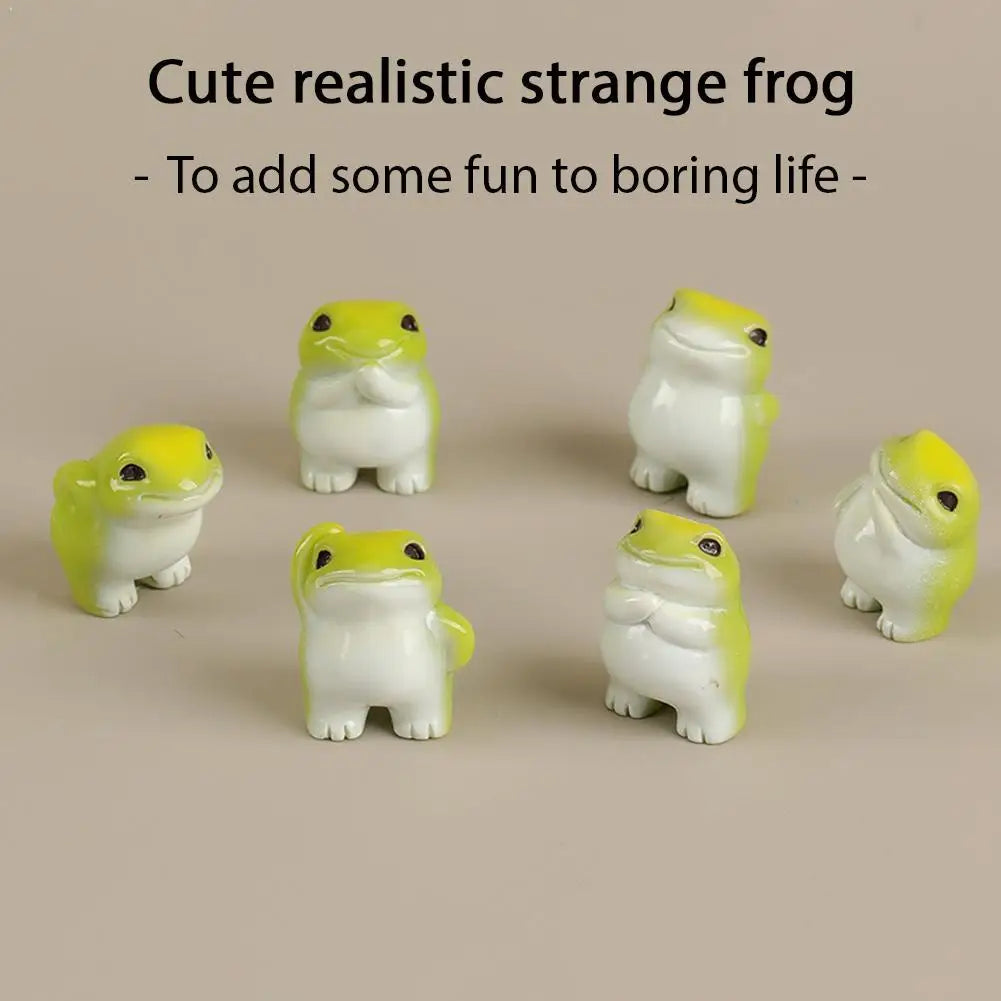 A set of six cute realistic strange frog figurines in white and yellow resin for desk or garden decor.
