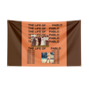 A dark brown tapestry with orange text featuring the phrase The Life of Pablo repeated multiple times and images of Pablo.