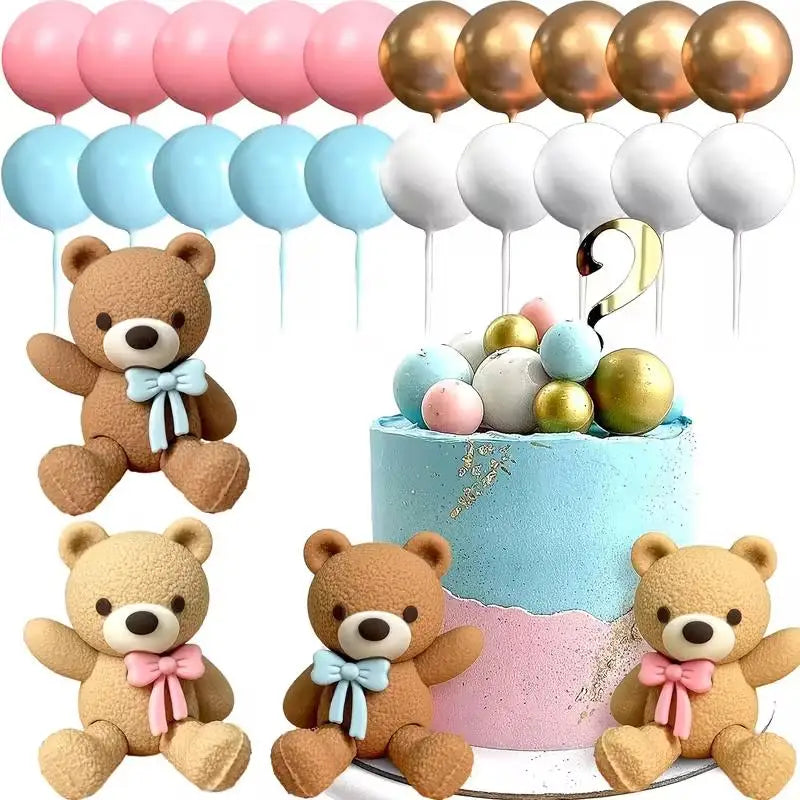 A collection of teddy bear cake toppers in various colors and finishes for a gender reveal party.