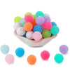 A pile of colorful textured resin beads in various shades including pink, green, blue, and orange.