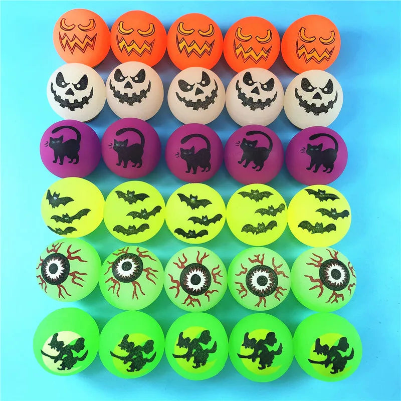A set of ten glow-in-the-dark Halloween bouncing balls featuring various spooky faces and cats in orange, white, purple, and 