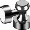 A silver magnetic sticker with a round, domed top and a cylindrical base.