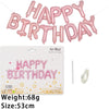 A set of 13 pink foil letter birthday balloons spelling out HAPPY BIRTHDAY