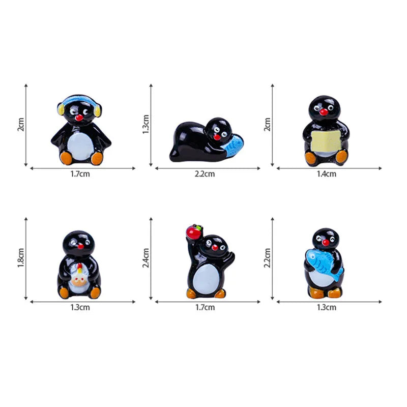 A set of cute cartoon penguin resin figurines in black and white for fairy garden or Christmas decor