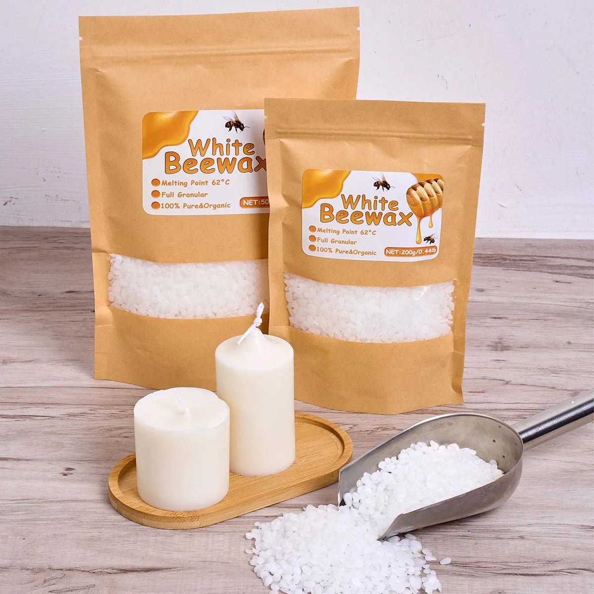A bag of white beeswax and several finished candles are displayed on a wooden surface.