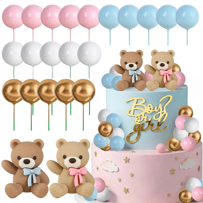 A tiered cake decorated with teddy bear toppers and pastel balloons for a gender reveal party.