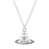 Silver pendant necklace featuring a vintage diamond-inlaid Saturn design.