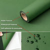 Roll of waterproof self-adhesive matte decor stickers on a green surface with loose stickers.