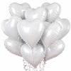 A bunch of white heart-shaped foil balloons tied together on a string.