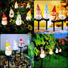 A collection of solar powered outdoor Christmas snowman lights in various colors and sizes displayed in a garden setting.